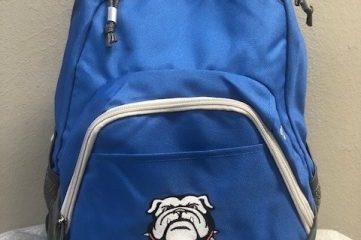 Backpack featuring an embroidered high school mascot logo, showcasing detailed stitching and vibrant colors, perfect for students to display school pride and carry their essentials